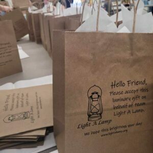 Brown bag with Project Lift Up gifts